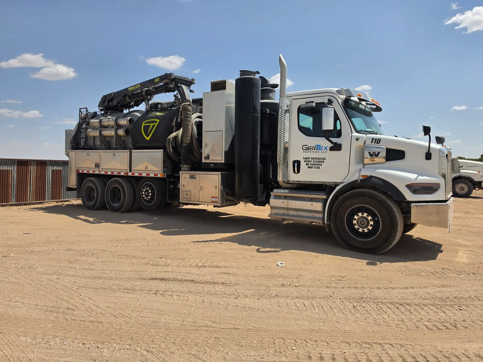 A Gentex hydro excavation truck in the yard, boom stowed and tank ready to roll